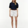 Broderte eyelets-top i blandet materiale