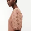 Broderte eyelets-top i blandet materiale