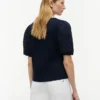 Broderte eyelets-top i blandet materiale