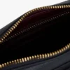 Crossbody-veske med preget monogram over hele overflaten