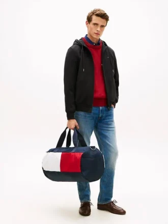Dufflebag med fargeblokker og flagglogo
