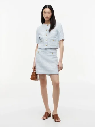 Mini-skjørt i tweed med gullknapper