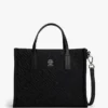 Mini-veske i nylon med monogram og synlige sømmer