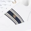 Sneakers med stroppestripe og skinnsåle