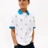 Stretch-polo med nautisk logo over hele for barn