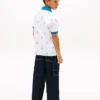 Stretch-polo med nautisk logo over hele for barn