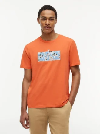 T-skjorte med tropisk blomsterlogo
